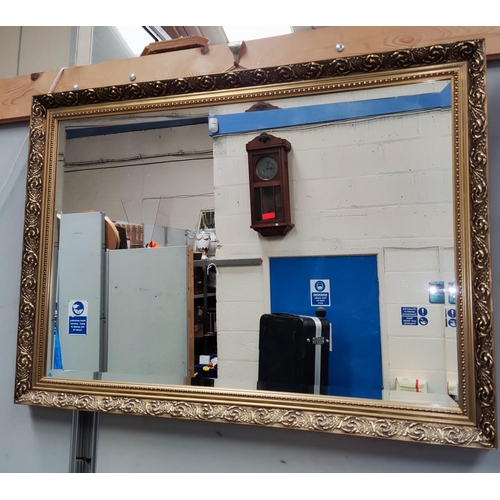 128A - A rectangular gilt framed wall mirror.