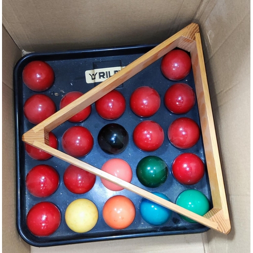 43A - A selection of vintage pool cues and rests