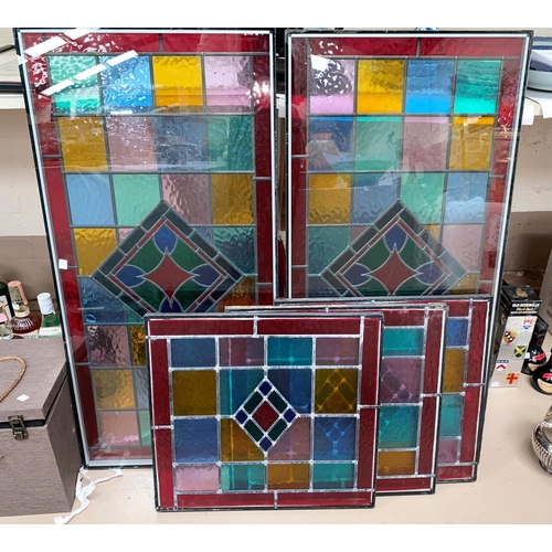 585 - A pair of stained glass window panes, 90 x 44cm (in double glazed sealed units), 3 stained glass win... 