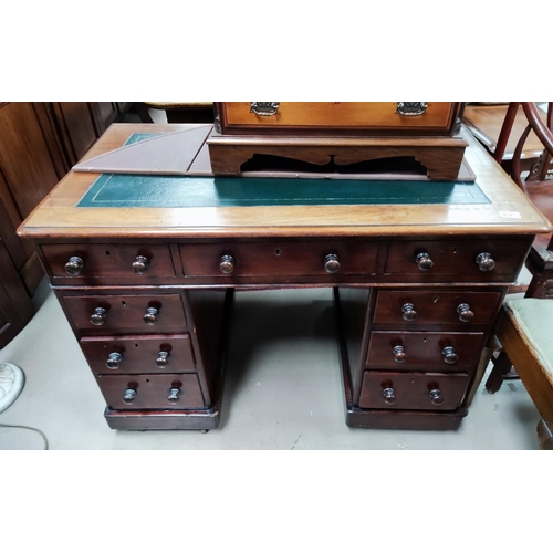 834 - A Victorian mahogany kneehole desk with 3 frieze drawers and 6 pedestal drawers