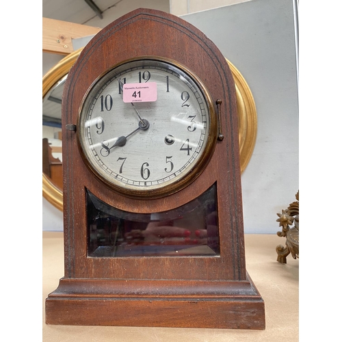 41 - A mantel clock with silvered dial in inlaid mahogany lancet top case (no pendulum)We have been unabl... 