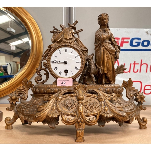 42 - A 19th century French mantel clock in gilt case, decorated with shepherdess, white enamel dial