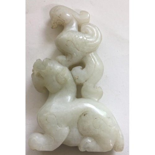 451A - Pale jade coloured hardstone carving of a bird on top of a beast