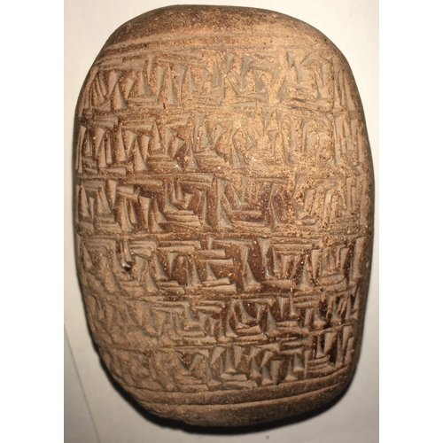 452 - A tablet with cunieform style decoration and a similar pottery bowl