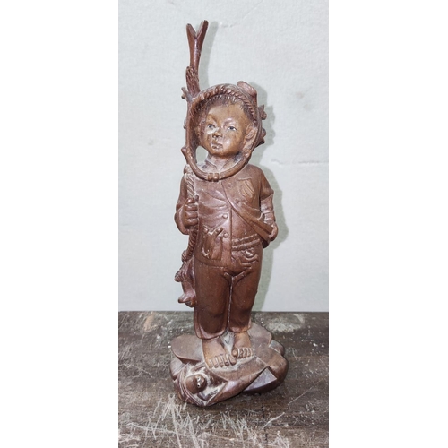 459A - A Chinese early 20th century wooden propaganda carving of a young boy