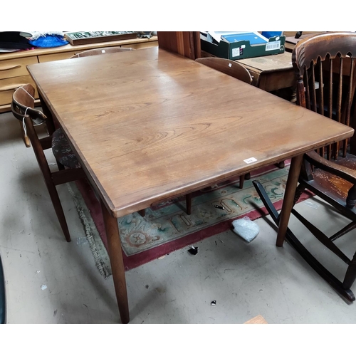 819 - A 1960's G-Plan teak dining suite comprising extending table with rectangular top, and 4 chairs with... 