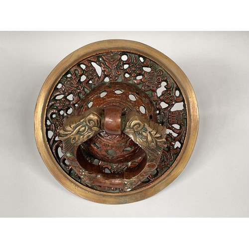 404 - A bronze door knocker in the Tibetan manor with a dragon handle.