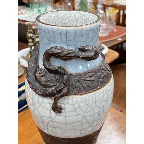 424B - A Chinese circa 1900 crackle glaze baluster vase with dragon in relief to around neck and marks to b... 