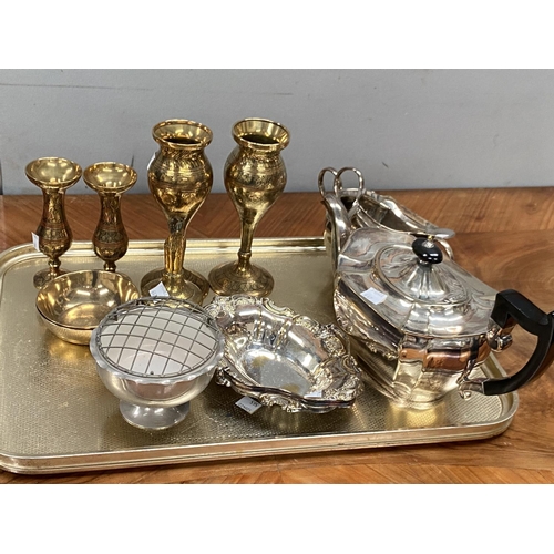 647 - A three piece silver plated tea service and a selection of brassware etc