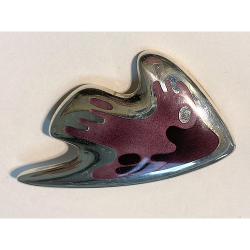 648 - Georg Jensen:  a modernist silver brooch in the form of a stylized fish with body in shades of ... 