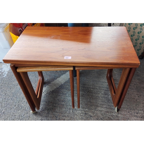 945 - A mid 20th century Mackintosh teak nest of 3 tables, larger one with flip top