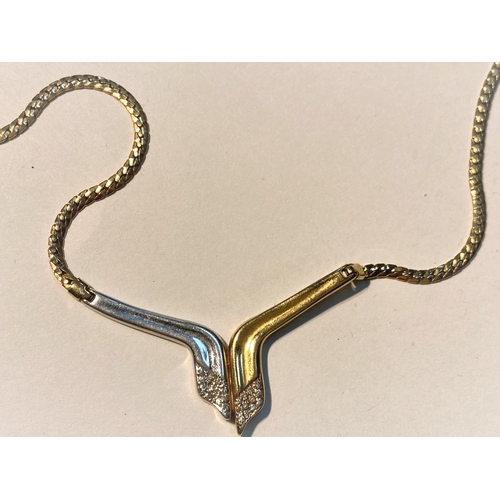 706 - A 9ct white and yellow gold diamond set necklace, stamped 375 to one side, 585 to the other, 14.3gms