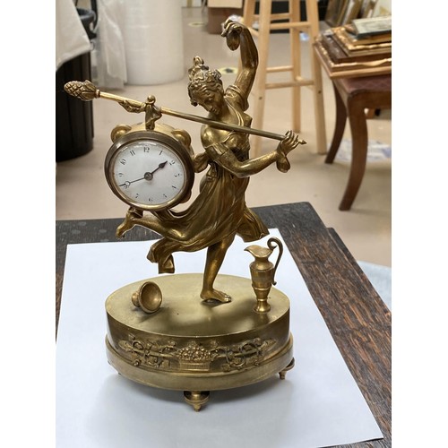 121 - A late 19th century gilt mantel clock with small enamel dial, Arabic numerals with female with staff... 