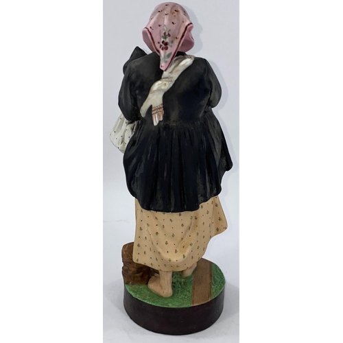 510 - A Gardner bisque group of barefoot Russian peasant woman in black coat and pink head scarf holding a... 