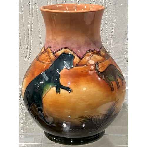 572 - A modern Moorcroft 'Dinosaur' vase of bulbous form decorated with dinosaurs in a desert setting, des... 