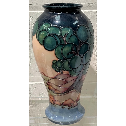 573 - A modern Moorcroft inverted baluster vase decorated with stylised trees in a landscape, monogrammed,... 