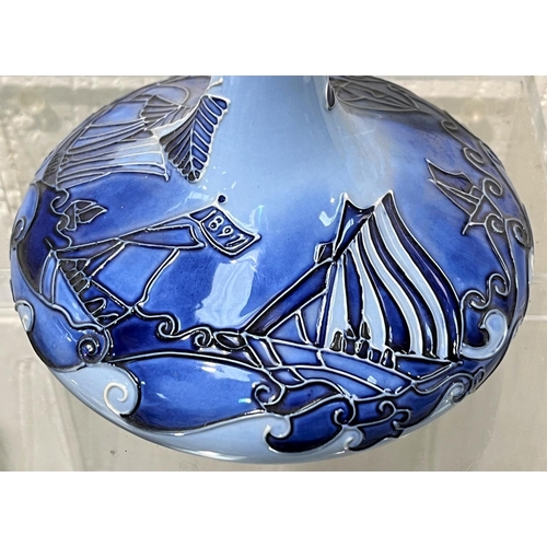 574 - A modern Moorcroft vase of squat form, with slender neck, decorated in 2 tone blue in the Macintyre ... 