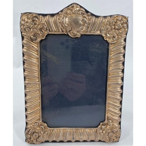 656 - A pair of hallmarked silver picture frames + another plated one.