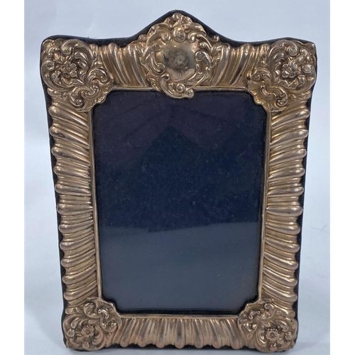 656 - A pair of hallmarked silver picture frames + another plated one.