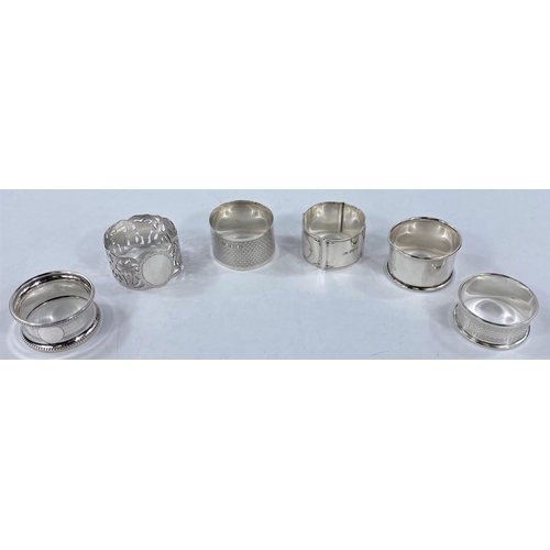 696 - A silver engraved  and pierced napkin ring, Birmingham 1913; 5 other hallmarked rings, 3.4 oz