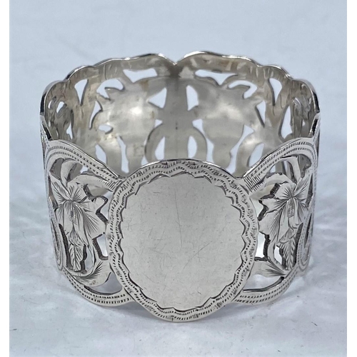 696 - A silver engraved  and pierced napkin ring, Birmingham 1913; 5 other hallmarked rings, 3.4 oz