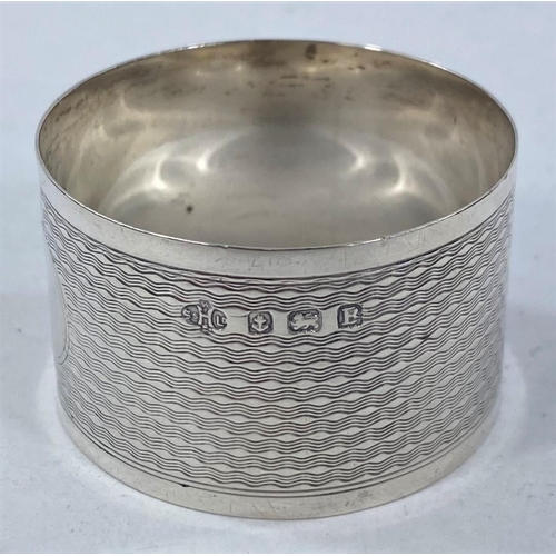 696 - A silver engraved  and pierced napkin ring, Birmingham 1913; 5 other hallmarked rings, 3.4 oz