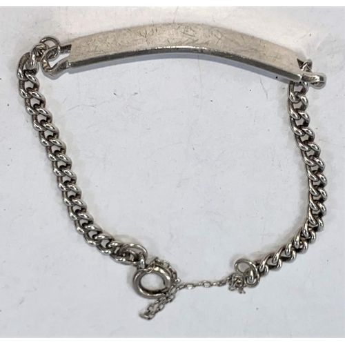 697 - A silver identity bracelet and a selection of white metal items, 2.5 oz gross