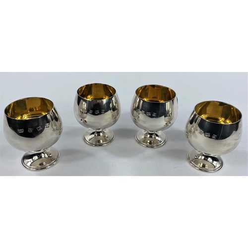 701 - A set 4 pedestal brandy cups in parcel gilt silver, maker A.T.C., Birmingham 3 x 1973, 1 x 1973, 12.... 