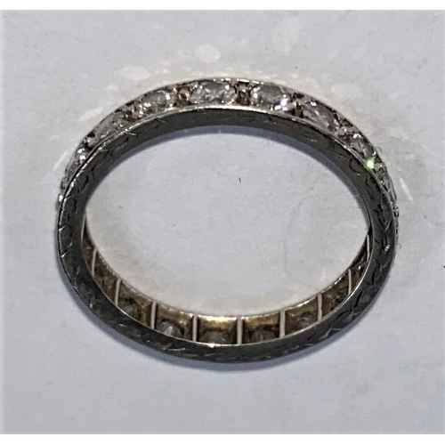 706 - A white metal eternity ring set 18 diamonds