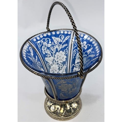 713 - An EPNS sugar basket with blue enamelled liner; a pair of cut glass salts with silver rims, spoons; ... 