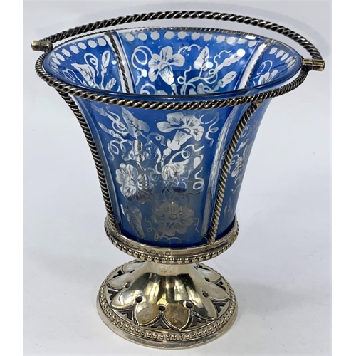 713 - An EPNS sugar basket with blue enamelled liner; a pair of cut glass salts with silver rims, spoons; ... 