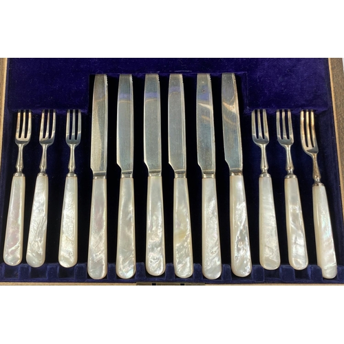 738 - A set of mother of pearl and hallmarked silver knives and forks, Sheffield 1920, a cased set of silv... 