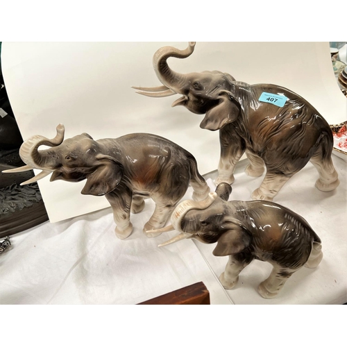 407 - A Royal Dux set of 3 graduating elephants, pink triangle mark, length of largest 39 cm