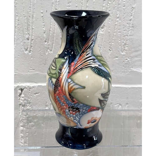 422 - A modern Moorcroft vase of baluster form 'Quiet Waters' decorated with carp in reeds and waterlilies... 