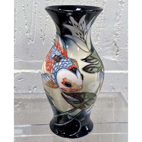 422 - A modern Moorcroft vase of baluster form 'Quiet Waters' decorated with carp in reeds and waterlilies... 