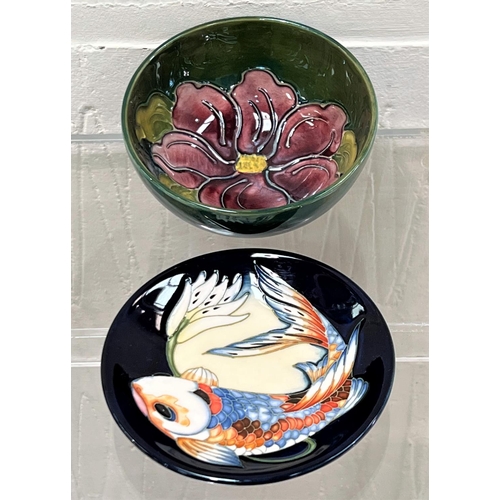 423 - A modern Moorcroft small circular dish 'Quiet Waters' decorated with carp in reeds and waterlilies, ... 