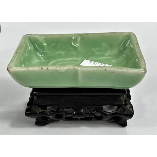 489 - A Chinese carved hardstone bowl dia. 13cm and a Celadon coloured bowl on wooden stand