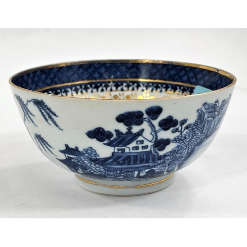 493 - An 18th century Chinese gilt highlighted blue and white bowl, 14.5cm