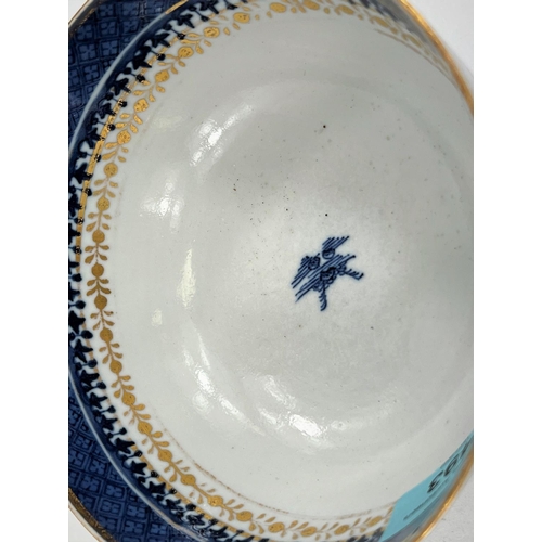 493 - An 18th century Chinese gilt highlighted blue and white bowl, 14.5cm