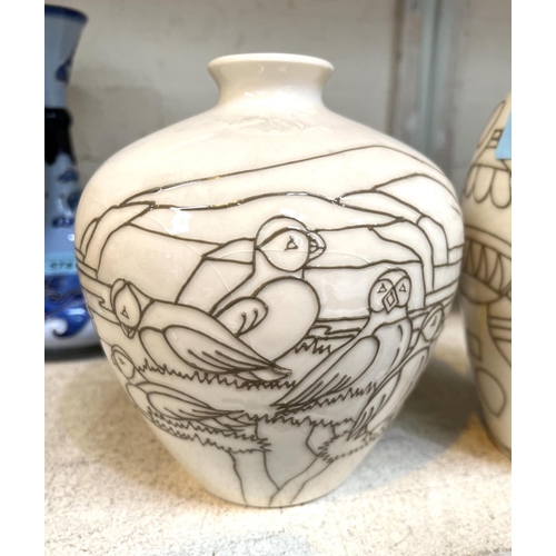 575 - A modern Moorcroft ovoid vase decorated with hot air balloons against a cream ground, impressed and ... 