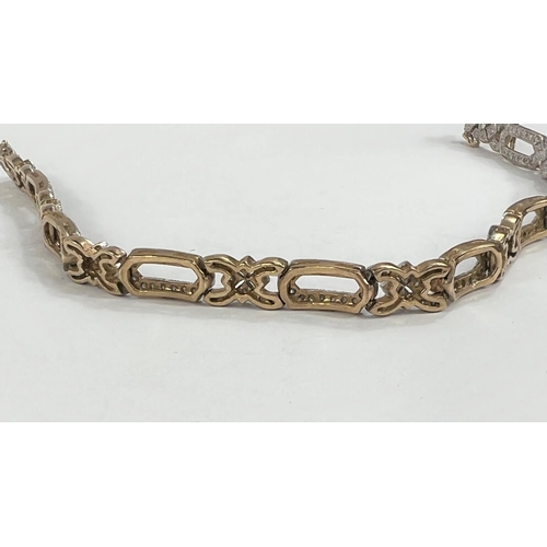 608 - A 9ct gold Art Deco ladies bracelet with diamond set chips, stamped 1 carat in total, stamped on cla... 