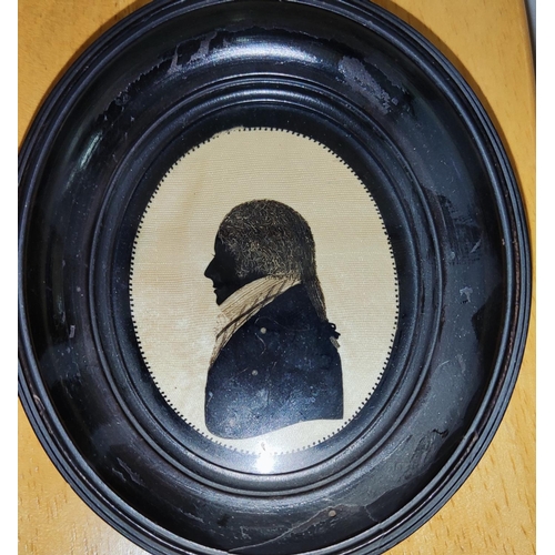 141 - Mrs I Beetham (1753-1825) A hand painted miniature silhouette of Georgian gentleman in profile in eb... 