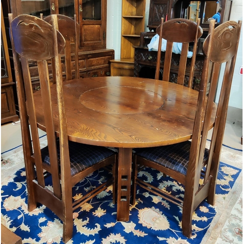 991 - A Charles Rennie Mackintosh style dining suite with circular dining table, with central lazy Suzanne... 