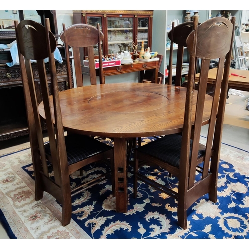 991 - A Charles Rennie Mackintosh style dining suite with circular dining table, with central lazy Suzanne... 