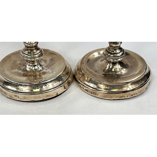 755 - A pair of hallmarked silver candlesticks, London 1920 ( areas of denting/wear) and two hal... 