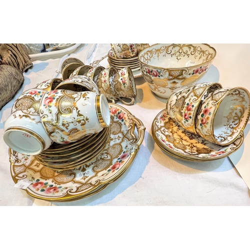 508 - A mid 19th century Rockingham style part tea service with gilt decoration and pink rose rims, approx... 