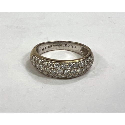 614 - An 18 carat gold half eternity ring with 3 rows of diamonds, approximately 43 diamonds in total, 4.2... 