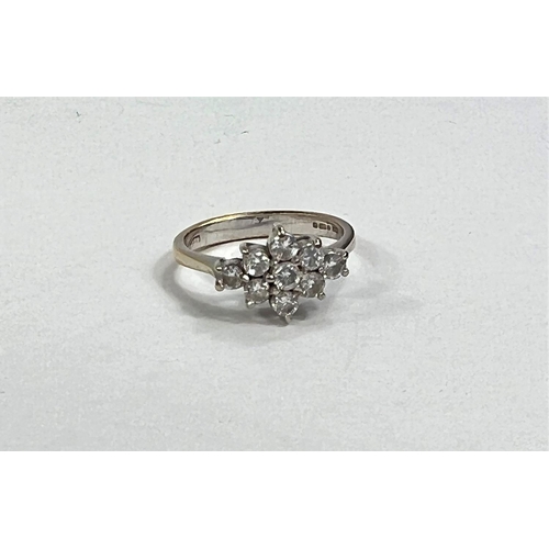 614a - An 18 carat gold dress ring set 9 diamonds in floral arrangement, stones approx. 3mm diameter, 3.9gm