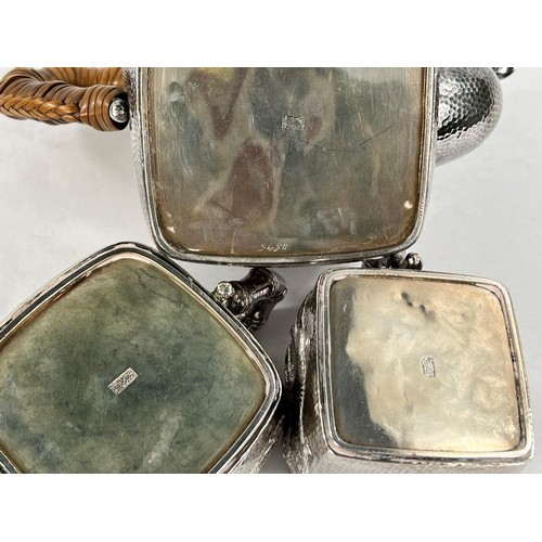 601 - An early - mid Chinese, 3 piece white metal tea set of square form, planished with raised dragon dec... 