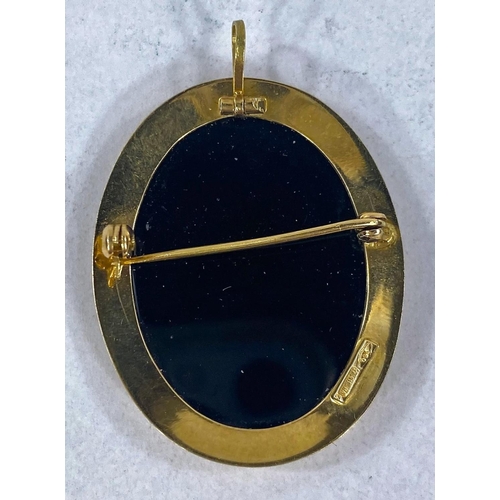 692 - A cameo brooch in blue and white agate, in yellow metal frame stamped '750', overall length 35mm